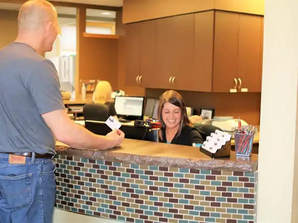 A patient checking into Serenity Sleep Dentistry