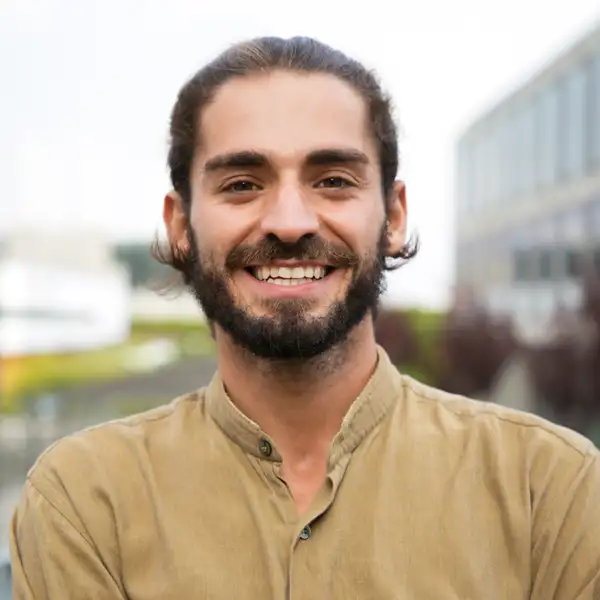 A man with a beard smiling