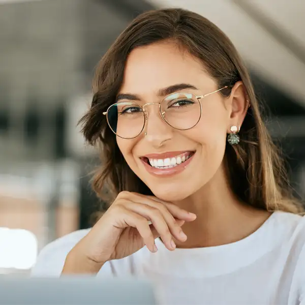 A young with glasses woman smiling